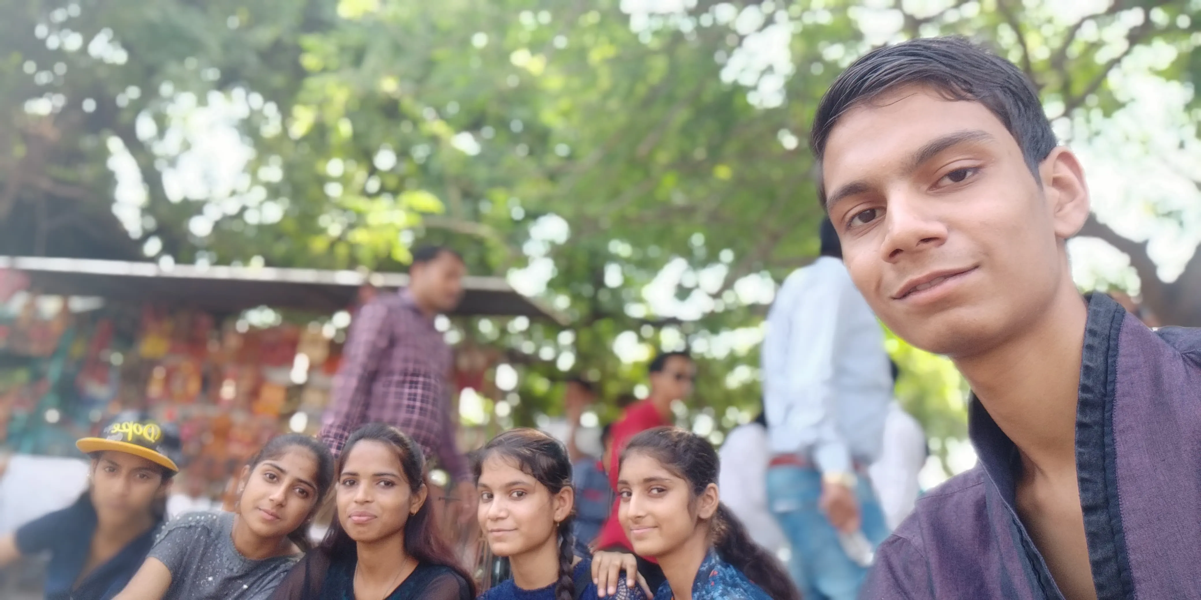 School Girls beaming for a group selfie